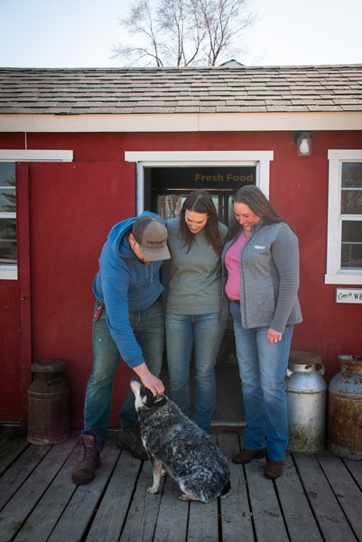 Three people posing for a picture.