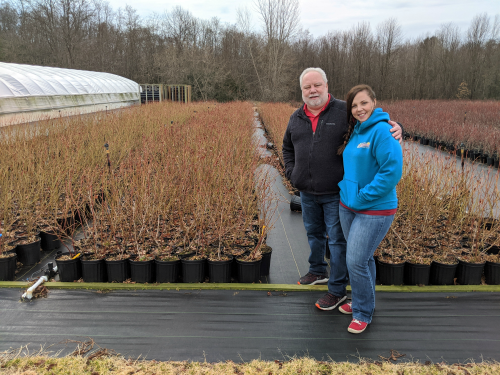 Roger and Jamie Stokes with Blueberry Plants