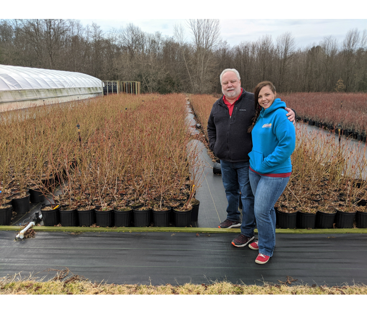 Roger and Jamie Stokes with Blueberry Plants