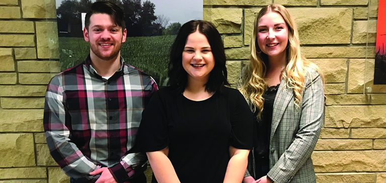 Preston Schaar, Katie Romzek, and Hailey Andres pose for a photo.