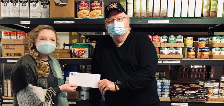 Taylor Martin giving check
