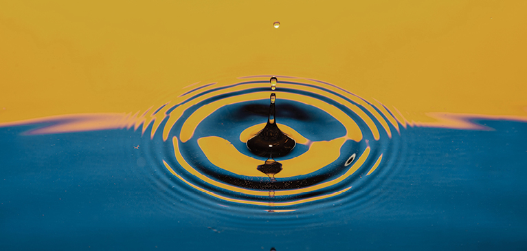 Drop of water in a lake.