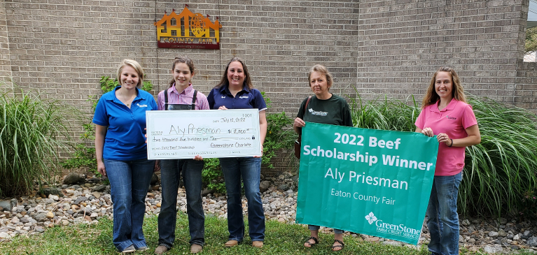 Aly Preisman with her scholarship award