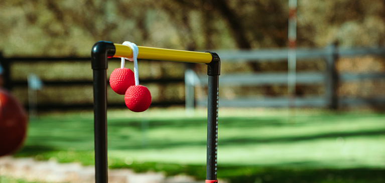 Ladder ball game in green yard
