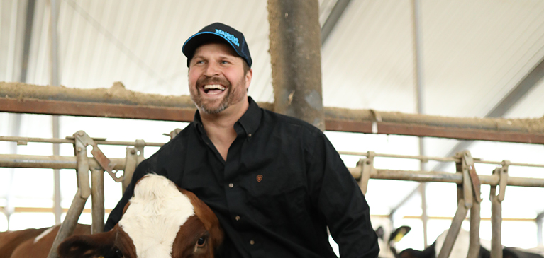 Member of Matsche Farms with cow 