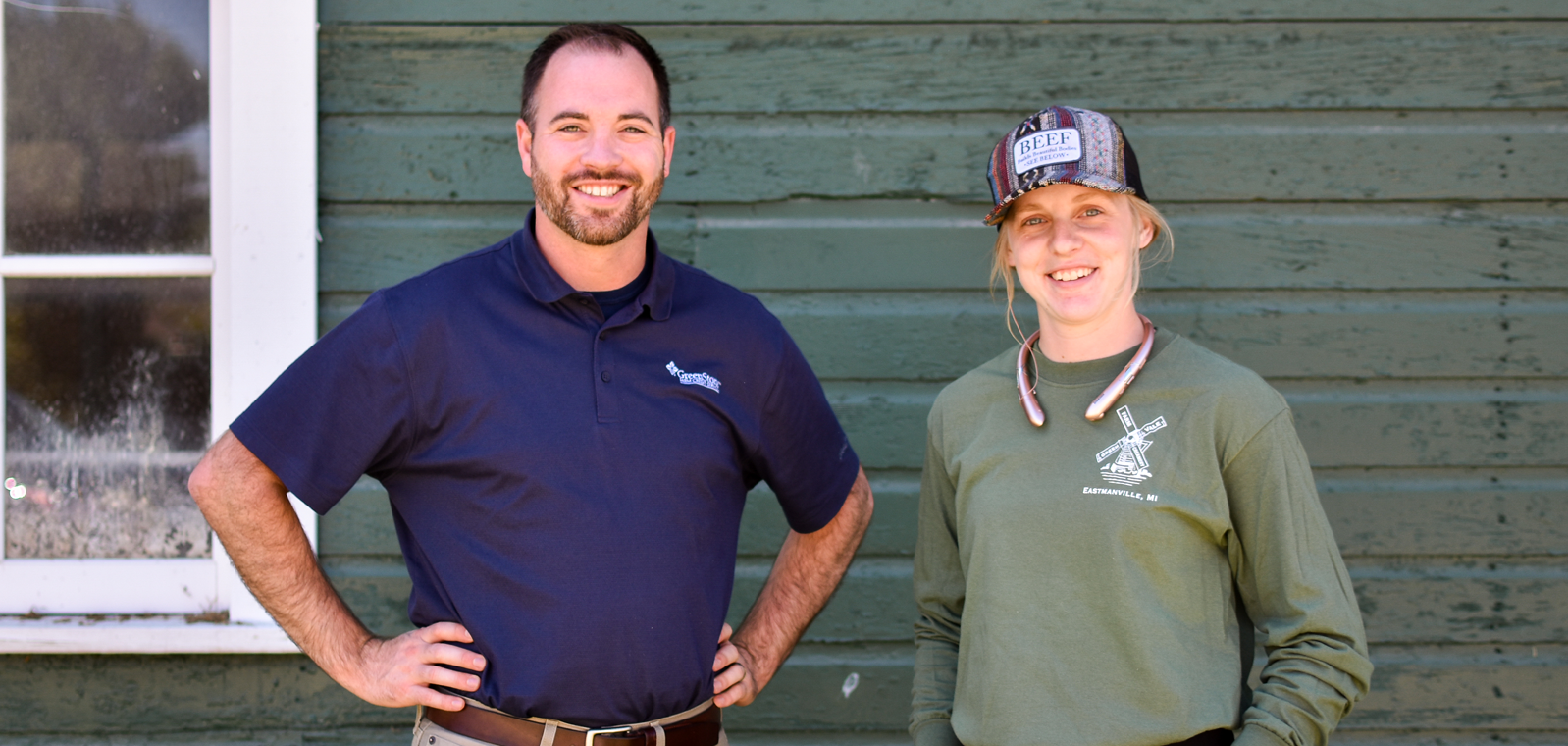 Heidi and Joel Arends pose in front of a barn