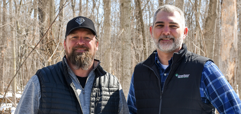 Two men in forest 