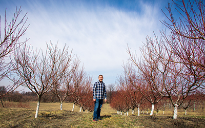 Kyle by apple trees