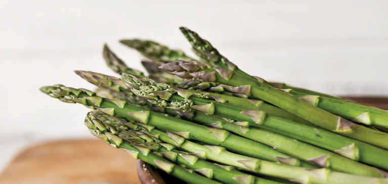 Asparagus on cutting board