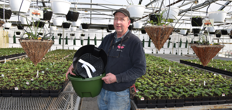 Karl Eckert in his greenhouse. 