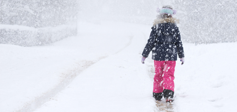 Child walking in snow