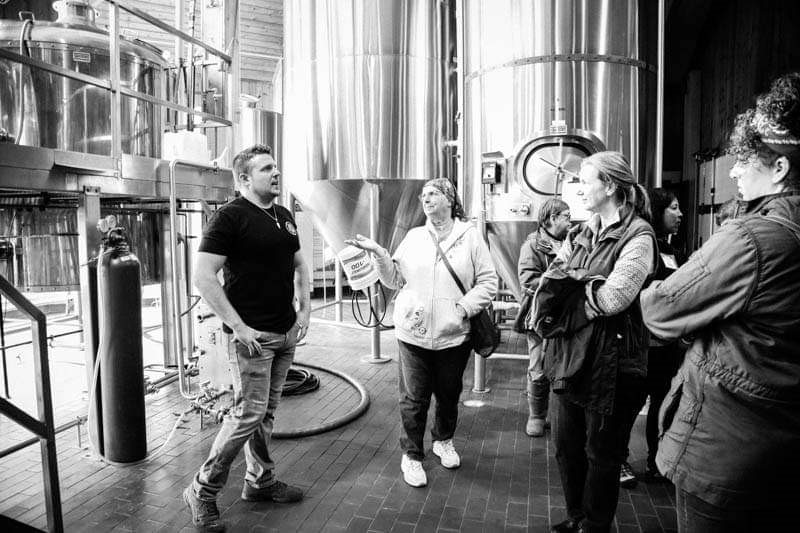 While on tour women from FWS listen to a presenter. 