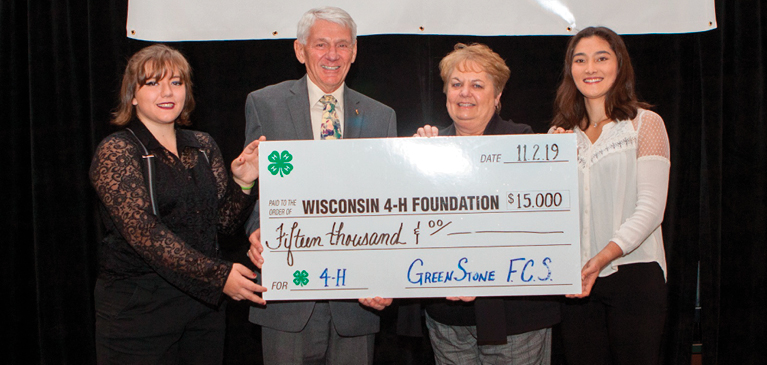 Pictured with check from GreenStone, [L-R] Armella Lane (Douglas County); WI 4-H Foundation Board Vice President, Jim Barthel; WI 4-H Foundation Board Treasurer, Nancy Bilz; MacKenzie Korent (St. Croix County). 