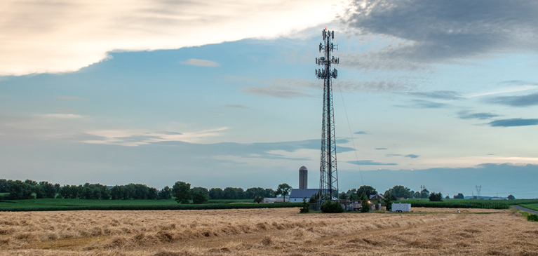 Services tower in a farm field 