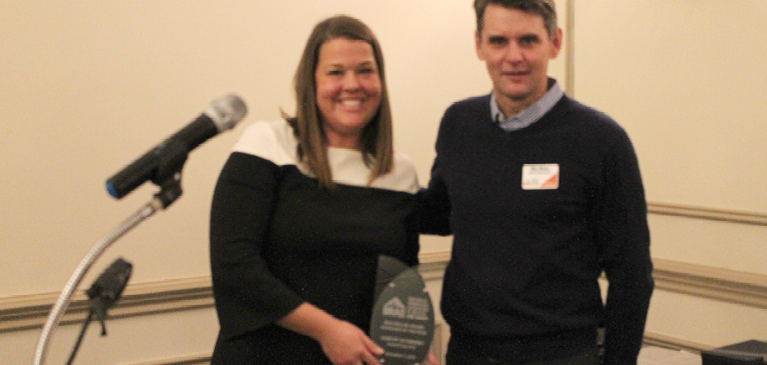 young woman receiving award