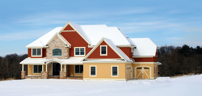 Newly built, two-story, red and yellow single family home.