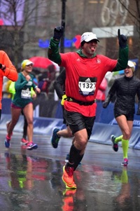 Duane Brown celebrating his Boston Marathon finish