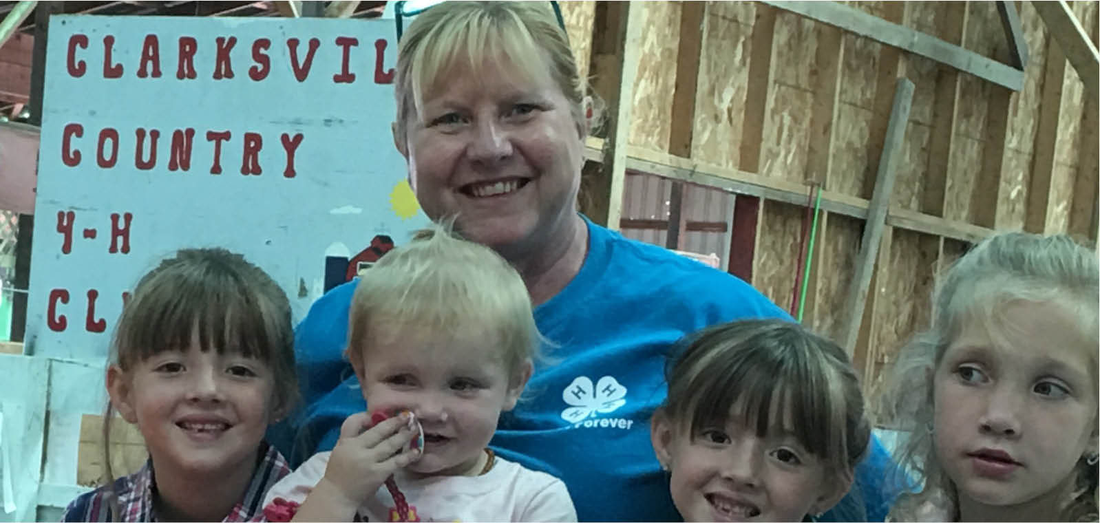 4-H leader with children