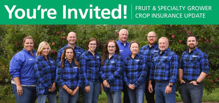 GreenStone's experienced team of fruit and specialty crop insurance stand in a group in a customer orchard in late summer with blossoming apple trees behind them.