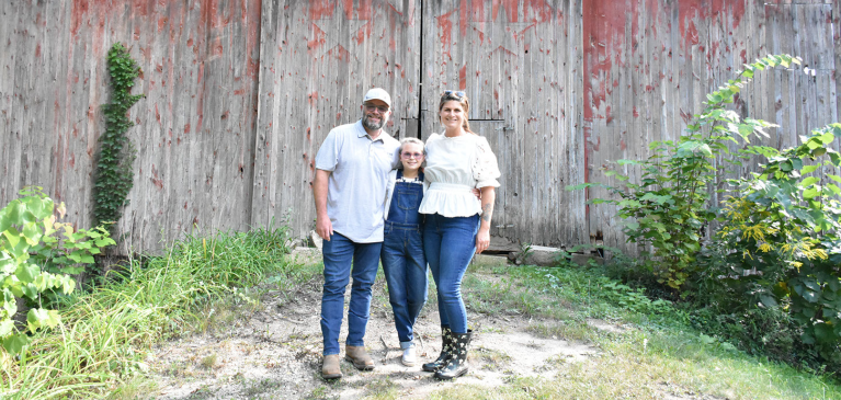 GreenStone customers Jeremiah and Carrie Mostrom with their daughter Sadie.