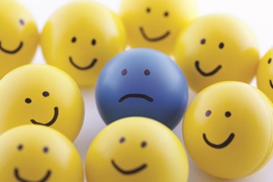 Bouncy balls with smiling faces and one frown face