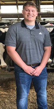 Dennis Cantrell on a dairy farm. 