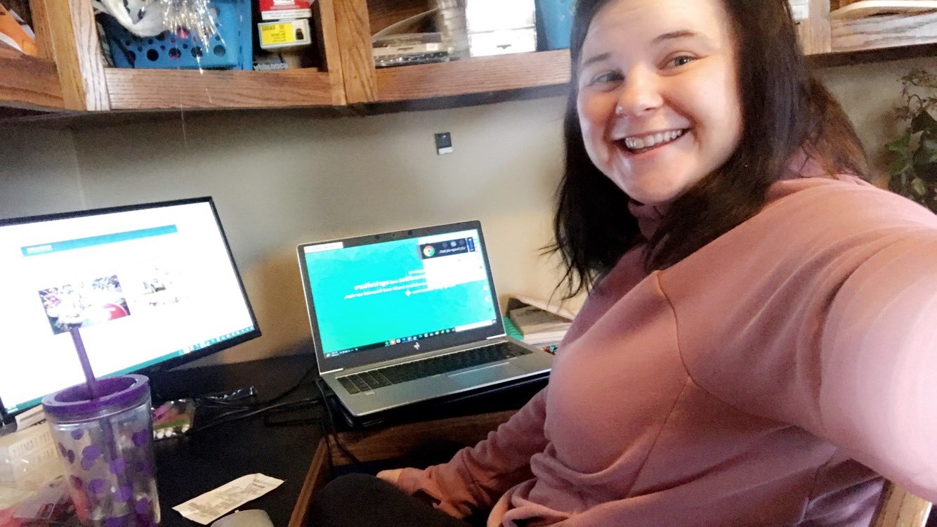 Katie Romzek sitting in home office. 