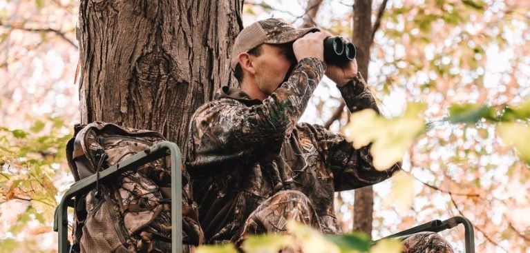 Jimmy from Michigan out of doors MOOD TV in deer stand while hunting in camo