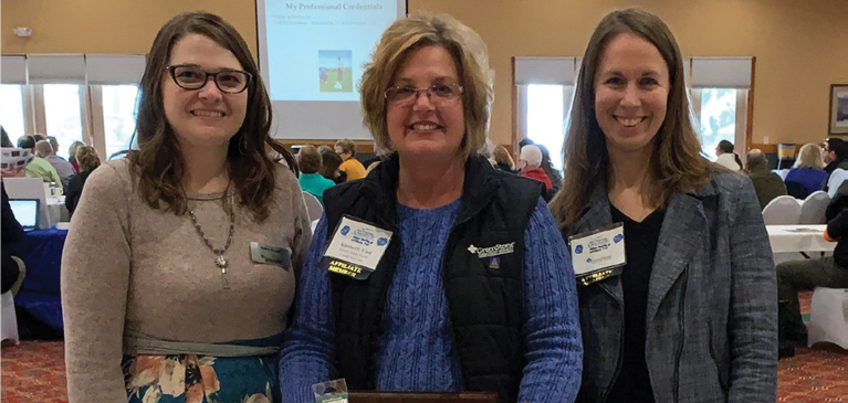 GreenStone employees from Cadillac branch celebrate Kim Cool's award as Affiliate of the Year