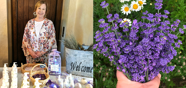 Janene standing in front of her table with lavender soaps, lotions, scents and homemade products.