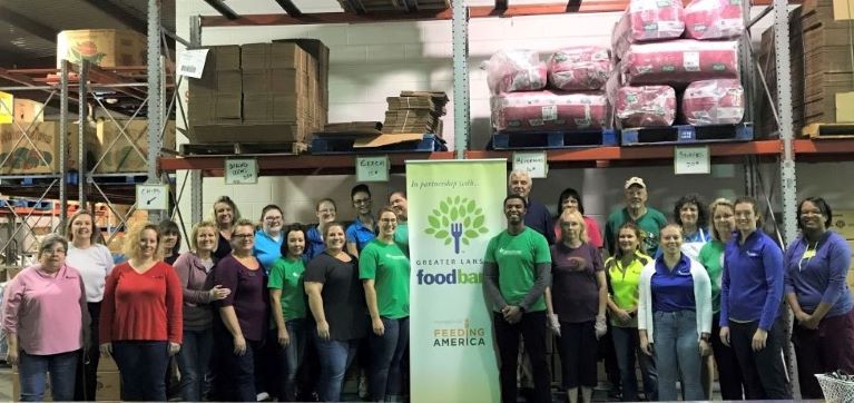 GreenStone legal services team volunteering together at the Greater Lansing Food Bank.