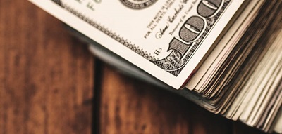 Old Wood Table Pile of 100 Dollar Bills