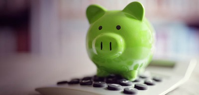 Green Piggy Bank on Calculator