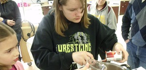 Kids making salsa at the 4-H event