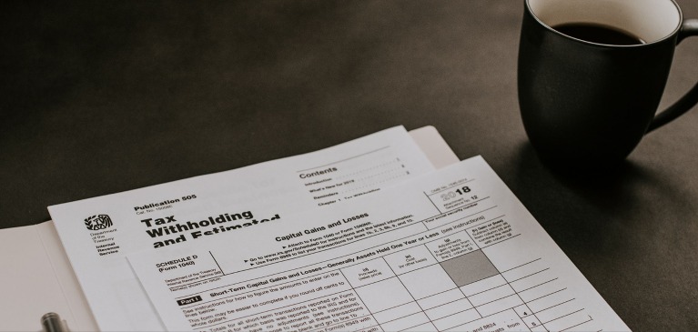 Tax planning and tax papers with coffee