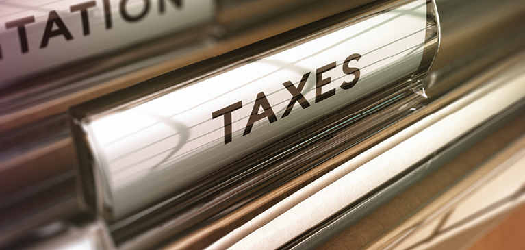 file with taxes written on it