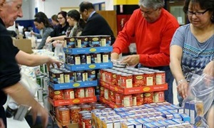 Volunteers packing weekend survival kits