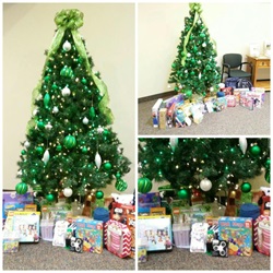 A Christmas tree with presents underneath at the Caro branch