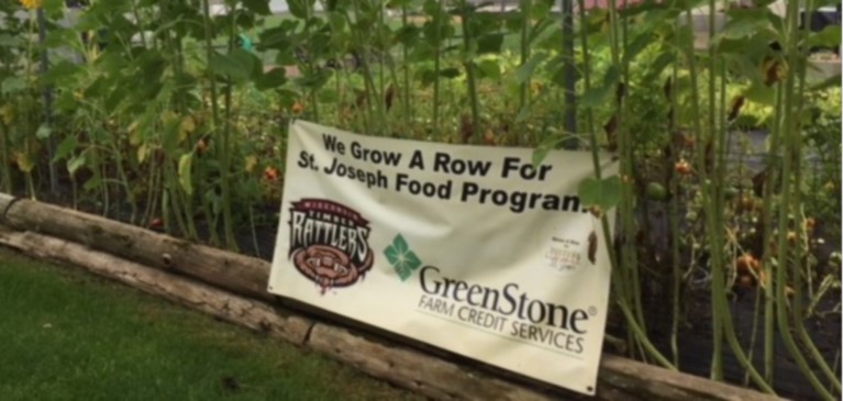 Banner for Timber Rattler's Community Garden Sponsored by GreenStone Farm Credit Services