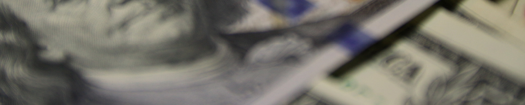Close up of one hundred dollar bill showing Benjamin Franklin