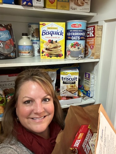 Woman standing in front of her pantry