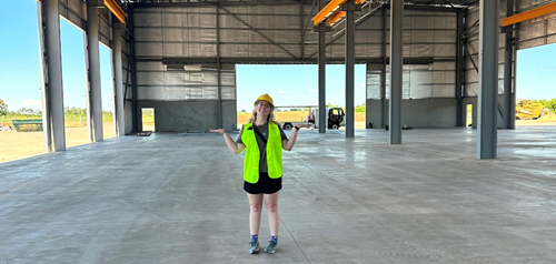 Woman standing in a building under construction