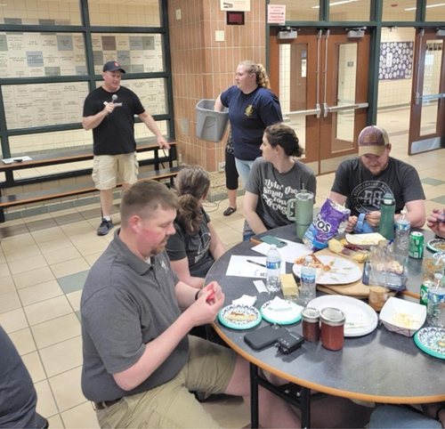 People in a cafeteria talking