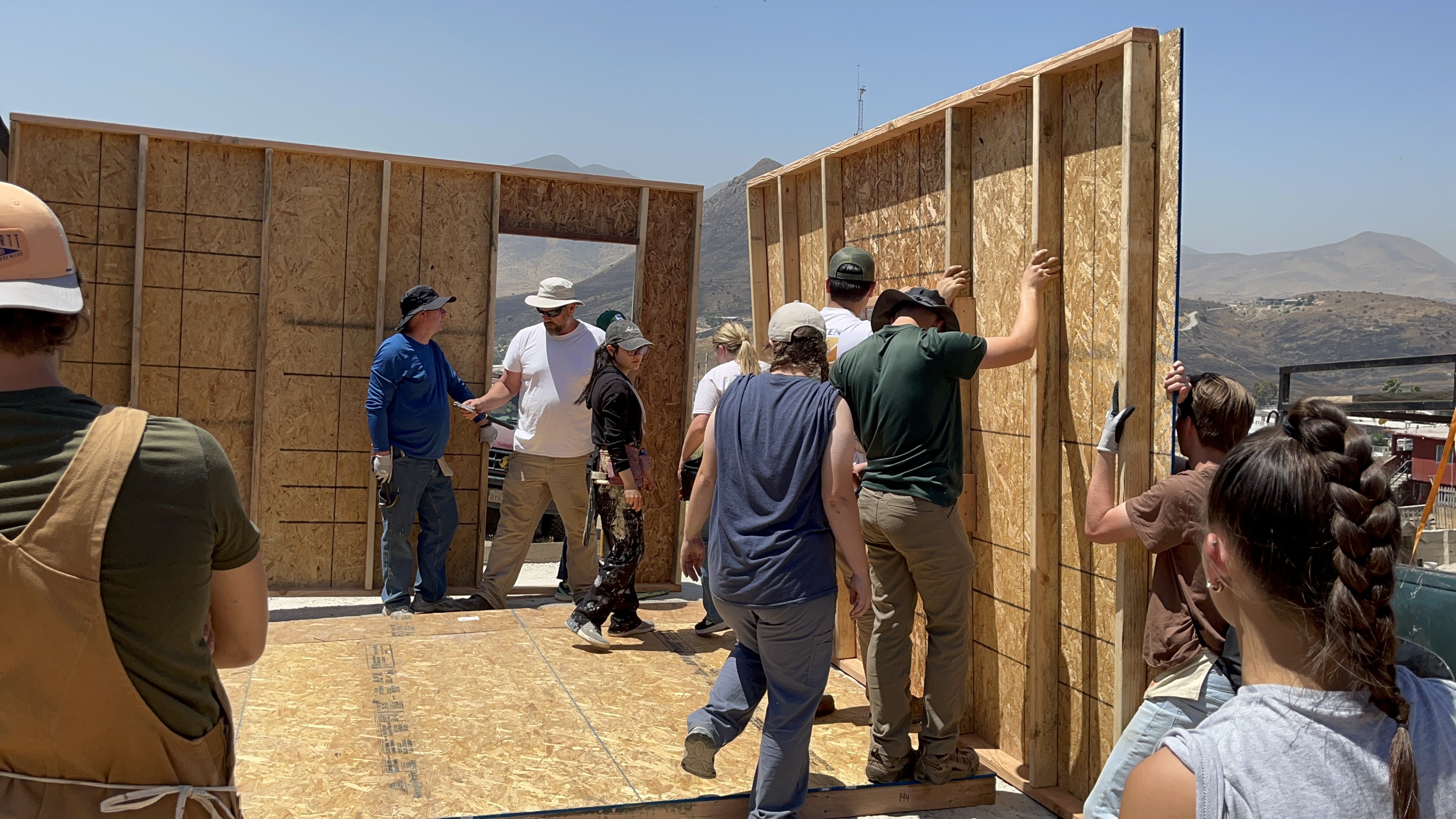 People building a house