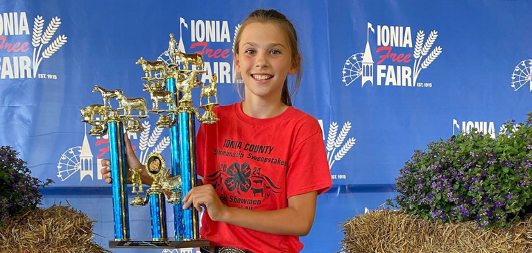 Child Holding Trophy
