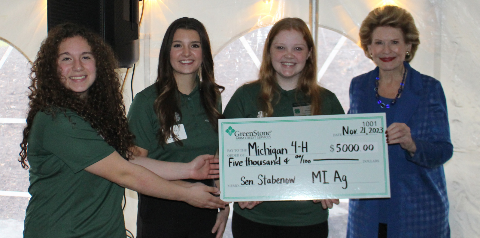 Senator Stabenow presents Michigan 4-H with donation check.