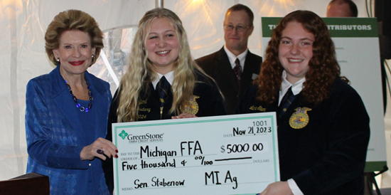 Senator Stabenow presents Michigan FFA with donation check.