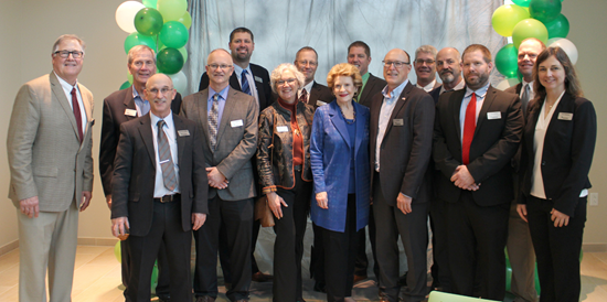 Senator Stabenow poses for a photo with GreenStone’s Board of Directors
