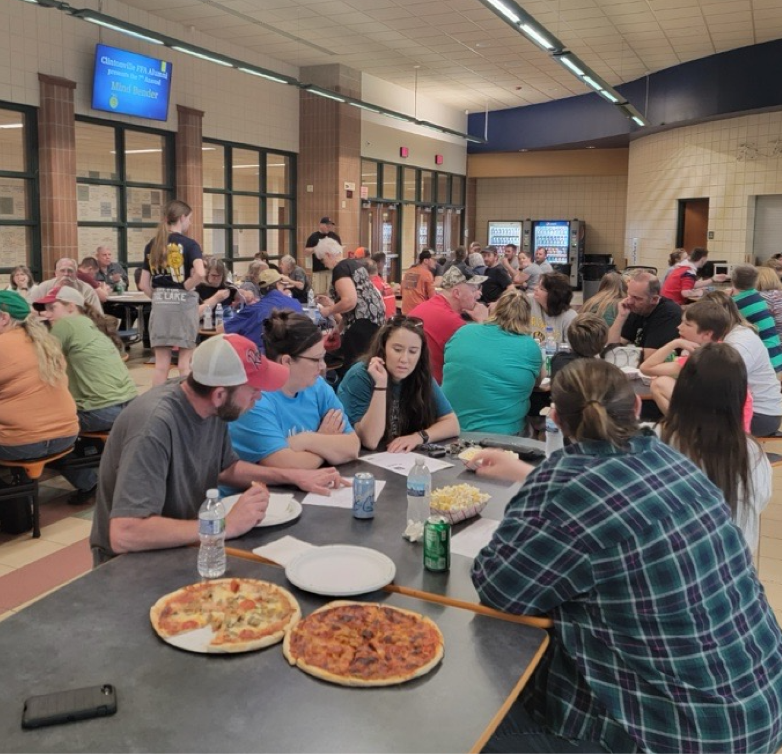 People in a cafeteria talking