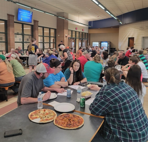 People in a cafeteria talking